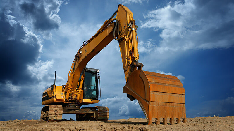 Front-end loader leveling the land